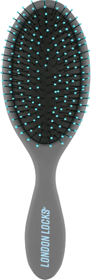 The Richmond out of its box: a grey cushioned brush with teal-tipped bristles